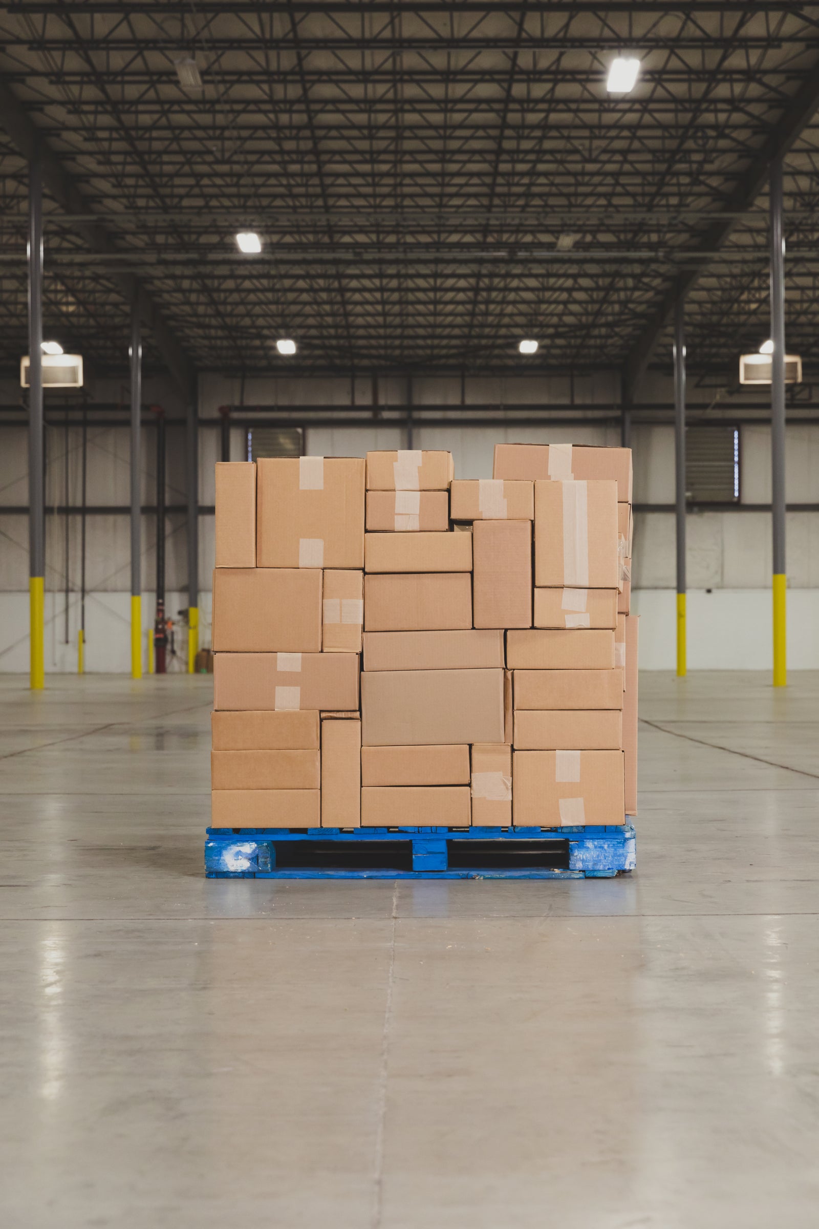 Pallet stacked with cartons on a warehouse floor